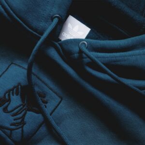 a close up of a hoodie with a tag on it