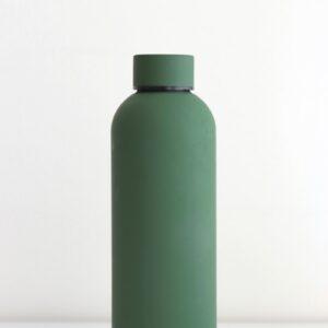 green bottle on white table